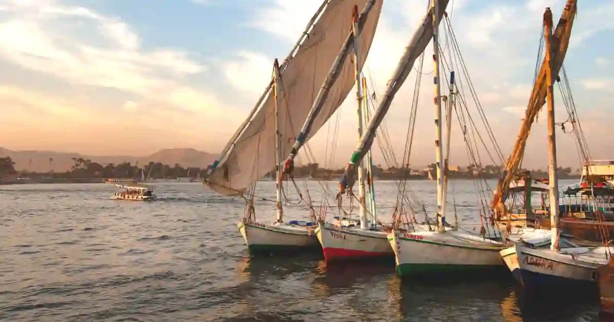 aswan-felucca-family-tour Family sailing on felucca boat in Aswan