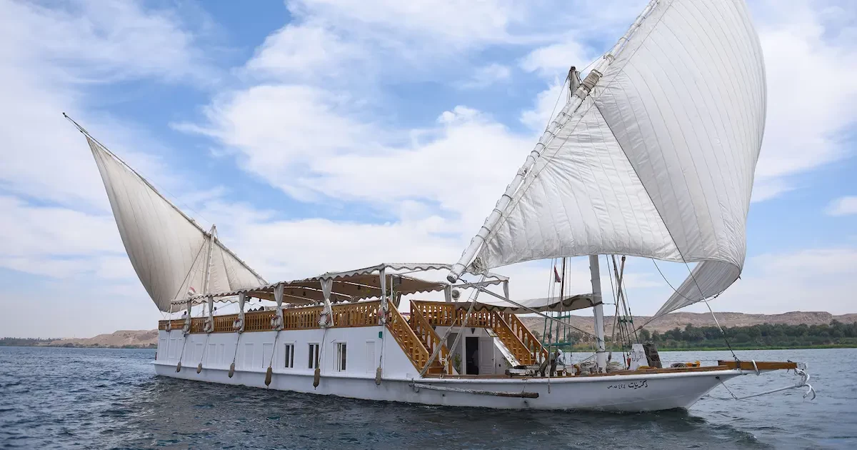 Dahabiya Zekrayaat sailing on the Nile