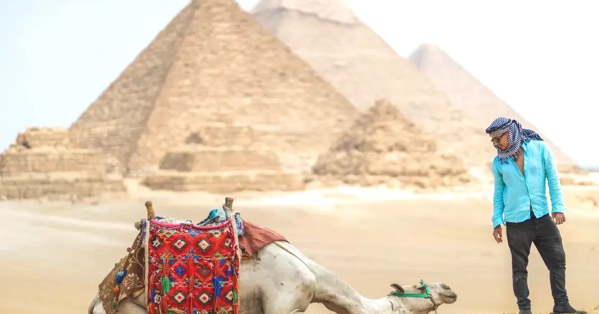 Tourists visiting Pyramids of Giza on budget Egypt tour