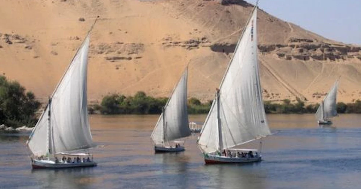 Traditional felucca sailing on Nile River in Aswan