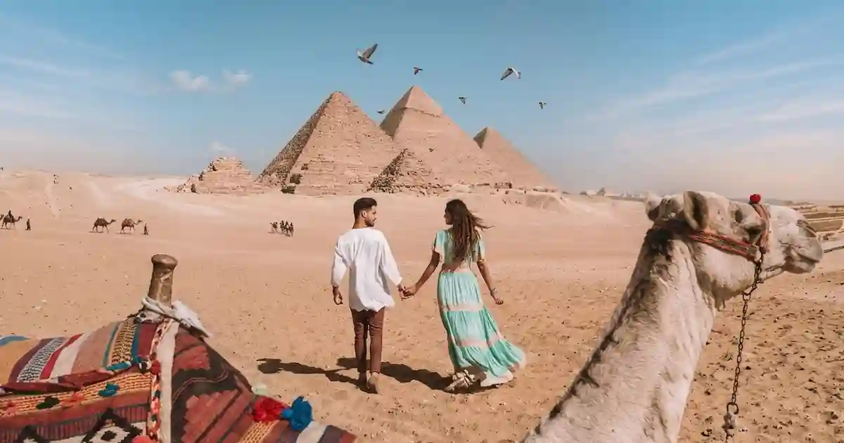 couple at pyramids during 8 days honeymoon in Egypt