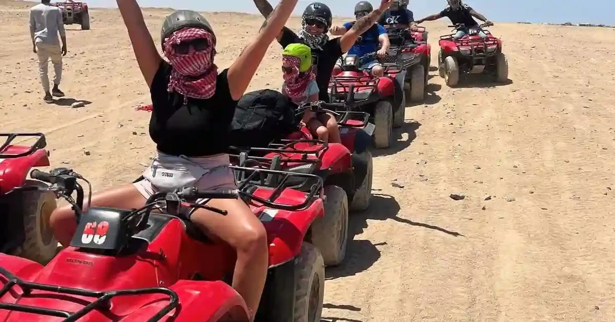 Hurghada quad safari riding through desert dunes
