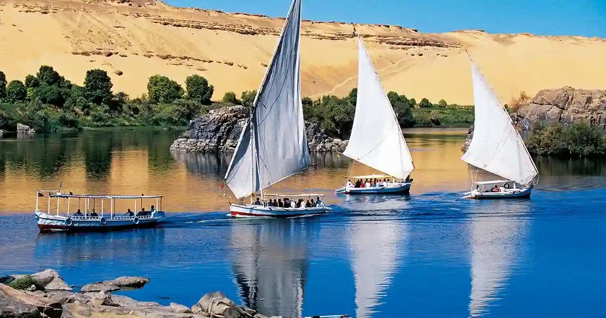 Felucca sailing Nile sunset Aswan Egypt cruise