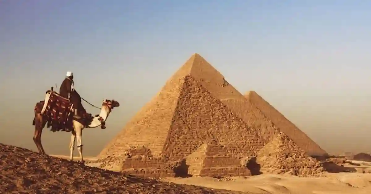 Travelers exploring Giza Plateau during Cairo day tour