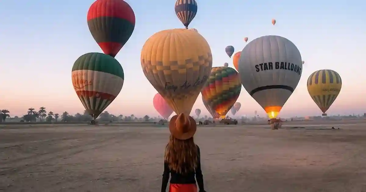 tourists enjoying hot air balloon Luxor