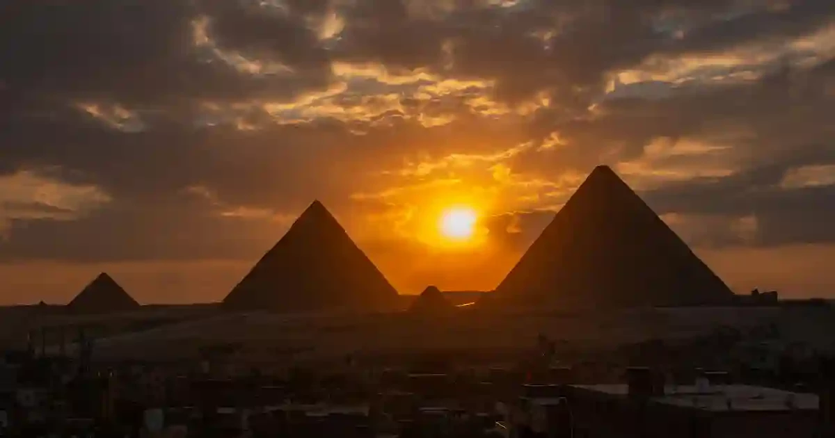 Sunset light over the pyramids during Cairo pyramids day tours