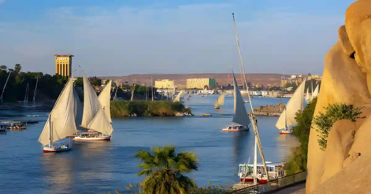 Traditional felucca sailboat drifting on the Nile River near Aswan on a 7-day Egypt tour